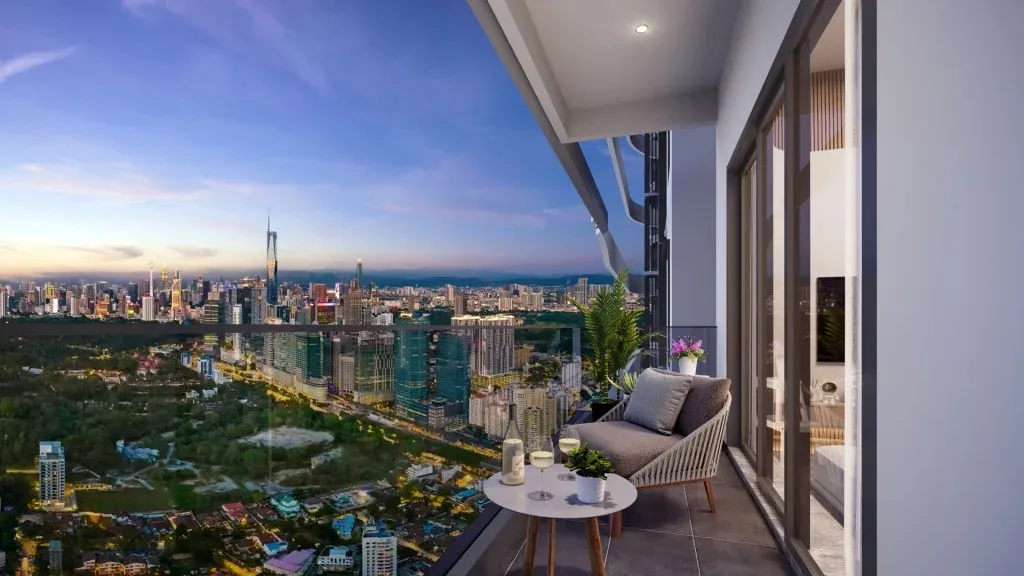 A balcony in Bangsar looking over the treetops towards the city at dusk