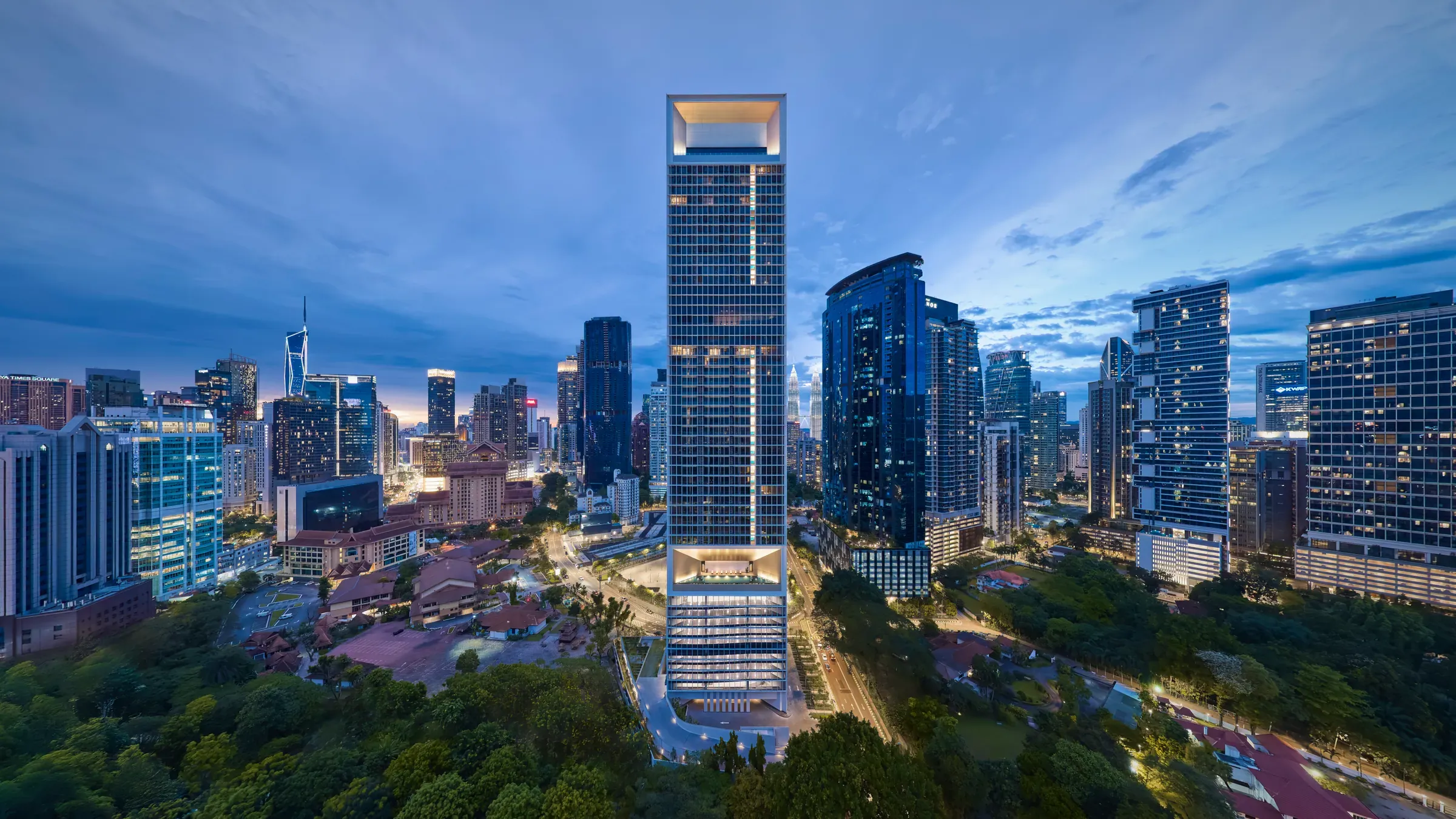The completed Conlay Signature Suites tower in the Kuala Lumpur skyline at dusk