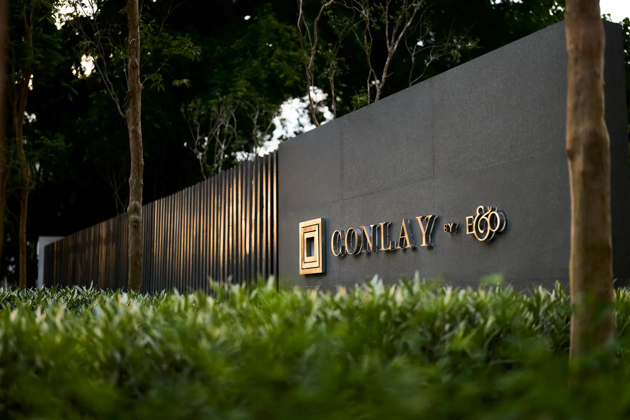 The Conlay entrance wall and landscaping at night
