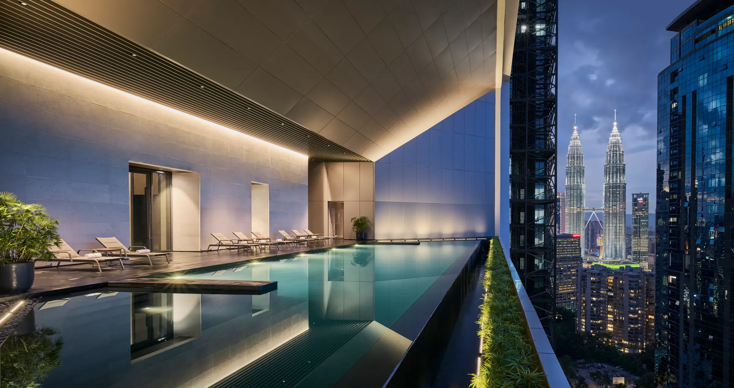 Conlay Signature Suites infinity pool at dusk