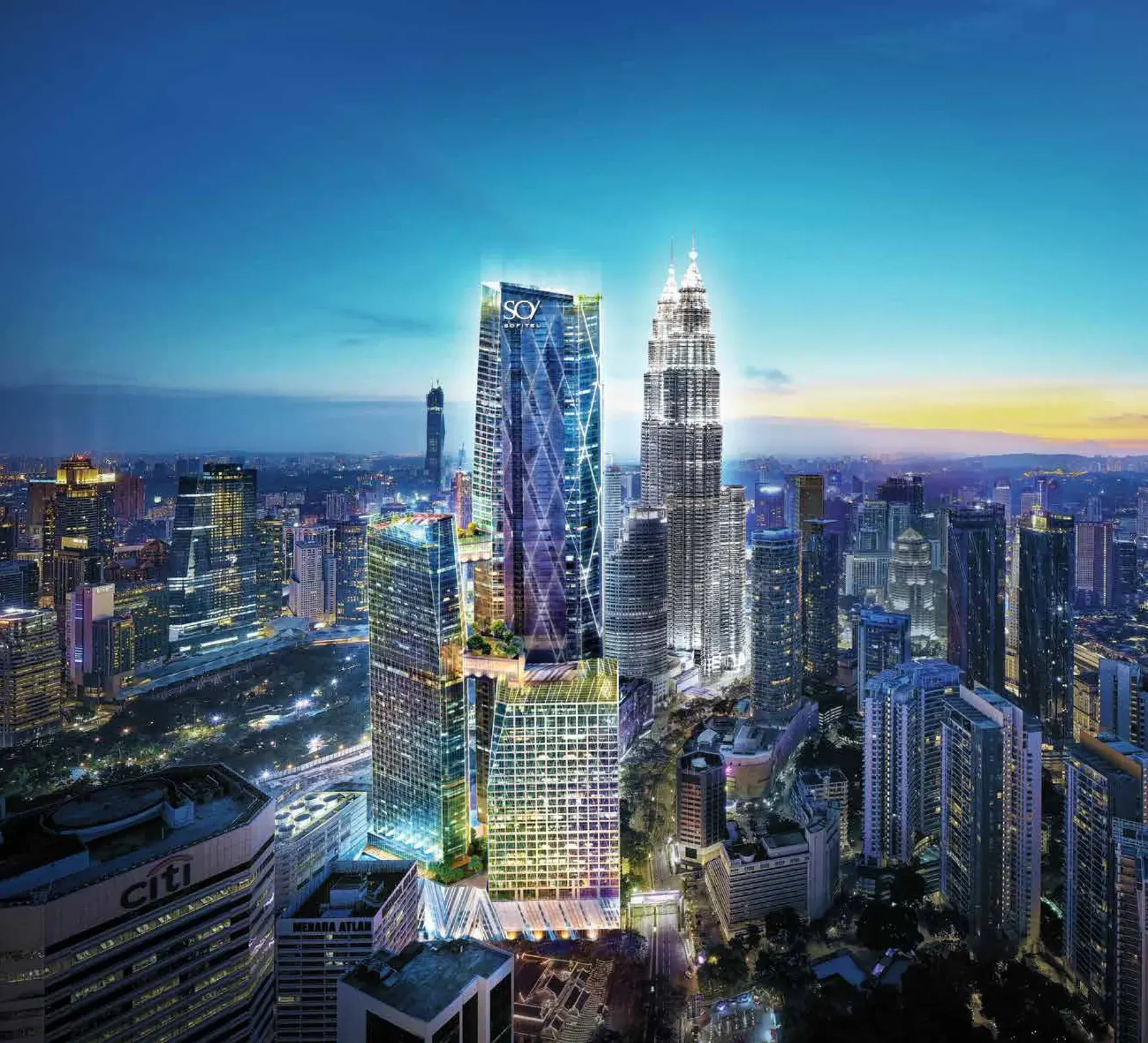 Aerial view of Oxley Towers beside the Petronas Twin Towers at dusk